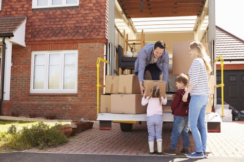 Professional house removalists assisting with packing in Kingston Storage
